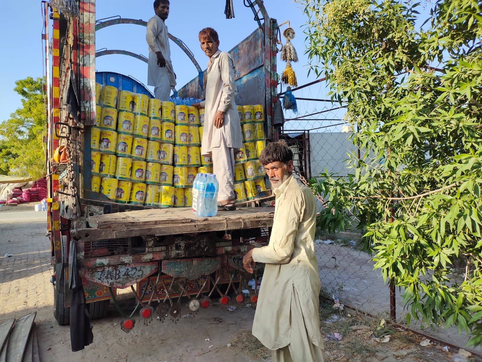 Cooking oil and food relief supplies being loaded for flood-affected families